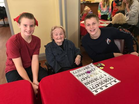 Eighth graders had an opportunity to be the hands and feet of Jesus by traveling to the West Bloomfield Orchard Villa Nursing Home to spend a little time with their residents.  The students enjoyed assisting the residents with Bingo, while engaging in del